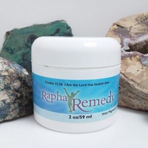 A jar of Rapha Remedy with Magnesium sitting next to some rocks.