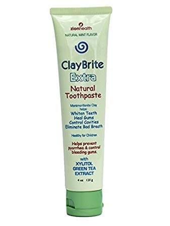 A tube of ClayBrite Extra natural toothpaste on a white background.